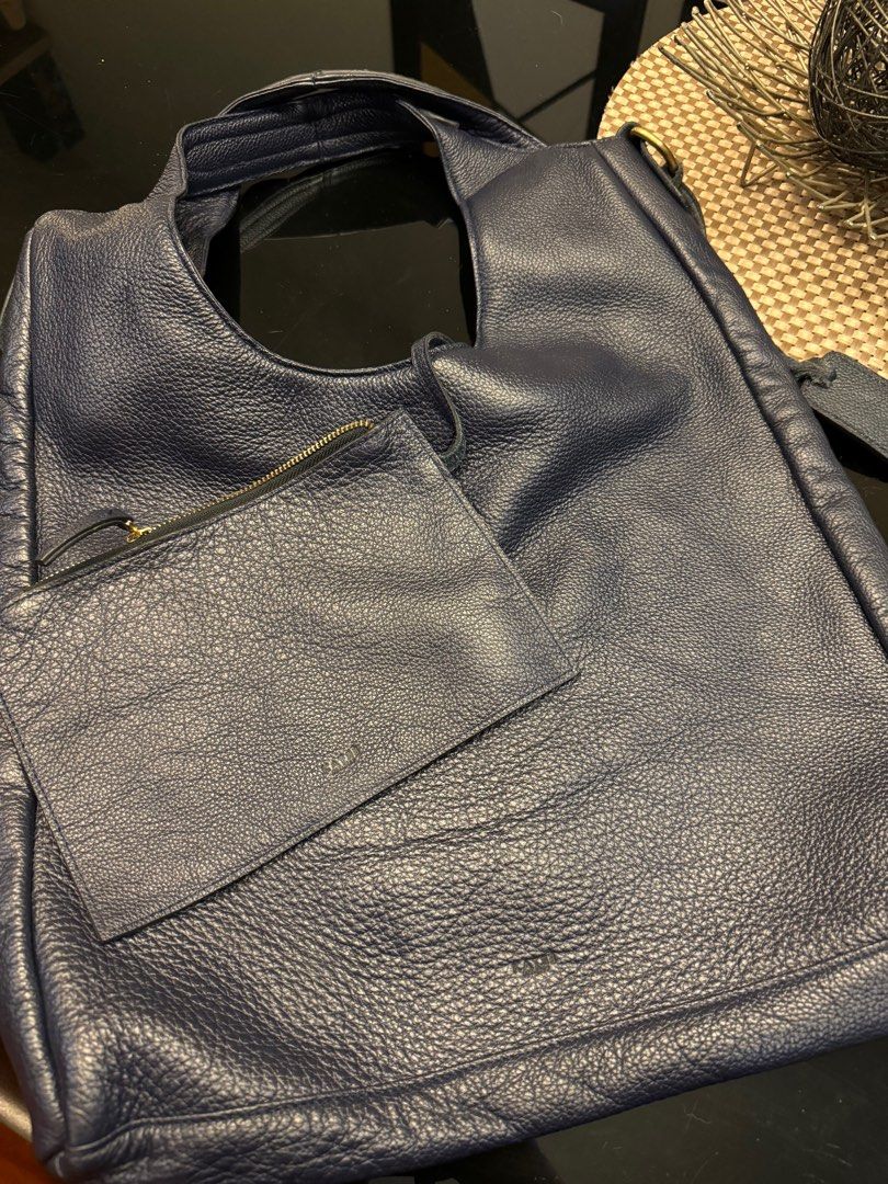 Katre Leather Baker Tote Bag (Navy Blue) (Category: Tote Bags) located in Malabon City. Submitted by yao.ming (Listing ID 1315827802, Image 2). Description: Slightly Negotiable Bought this but was surprised with the size, it’s really big and can fit laptops/ipad/etc. Haven’t used, just been stored because it’s a bit heavy since it’s legit leather ! :) Good for work/school Can fit a lot of things Includes free pouch .