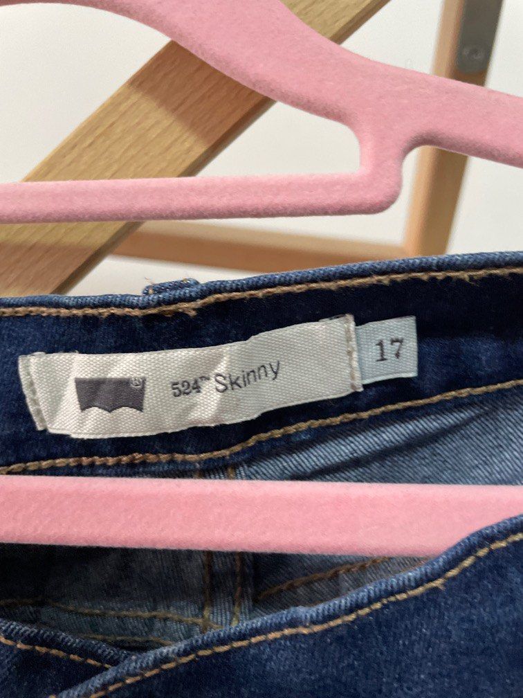Levis 524 skinny rip jeans