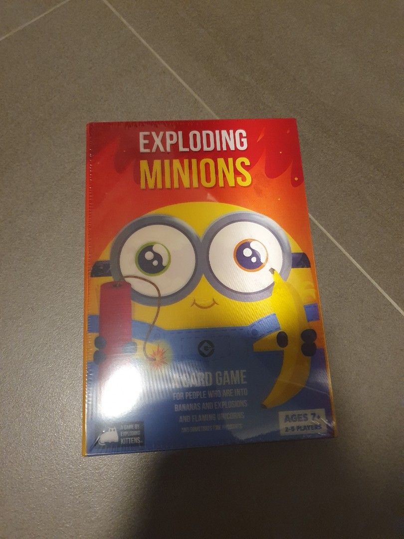Exploding Minions (Authentic) (Category: Board Games & Puzzles) located in Singapore. Submitted by shi.jingping (Listing ID 1316004605, Image 1). Description: Selling a brand new box of Exploding Minions. Product is authentic (see pic 3), it was bought from the official Exploding Kittens website. Free registered/tracked mailing is provided..