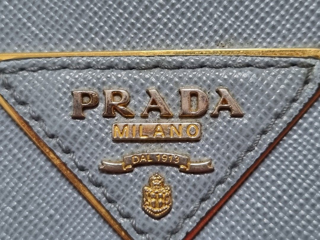 Prada Saffiano Metal Granato (Category: Luxury Bags & Wallets) located in Las Pinas. Submitted by janellskieee11 (Listing ID 1312692453, Image 3). Description: Personal preloved Original Prada long wallet with rubs at the corner of the wallet with box and cards light blue color may differ due to lighting.