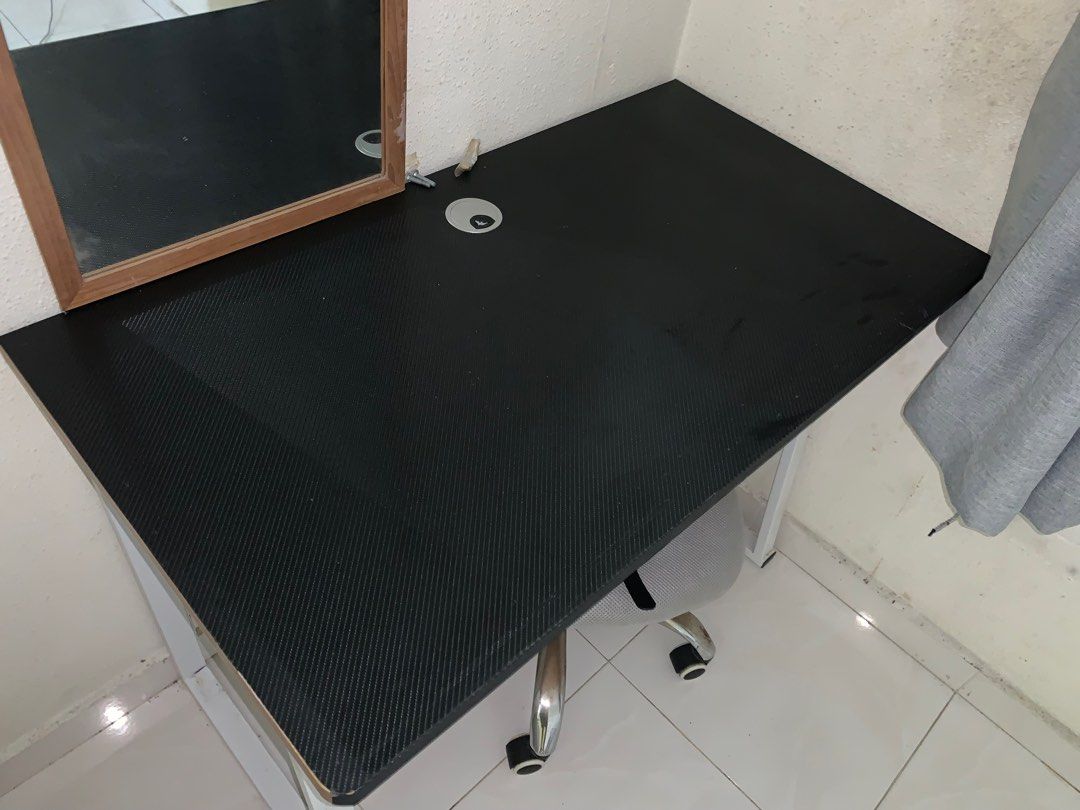 study table (Category: Tables & Sets) located in Singapore. Submitted by mr.zhg (Listing ID 1316007354, Image 2). Description: Stable study table with metal frame 100*55*75cm, self collect at Pasir Ris, after dismantle then can put in taxi boot.