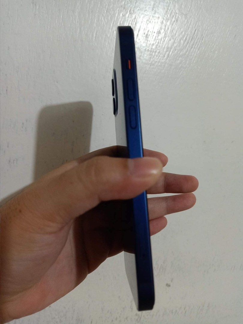 IPHONE 12 (64gb BLUE)‼️ (Category: iPhone 12 Series) located in Manila. Submitted by julsy111 (Listing ID 1316098050, Image 2). Description: FOR SALE‼️ Iphone 12 64gb Blue Inclusions - Original Box and replacement charger - Free 3 case (2 unused) - With tempered glass installed plus one free extra tempered glass No issues , smooth 82% Battery Health Face ID Working Very minimal dent on one corner (see picture attached) Unli reset RFS: will upgrad