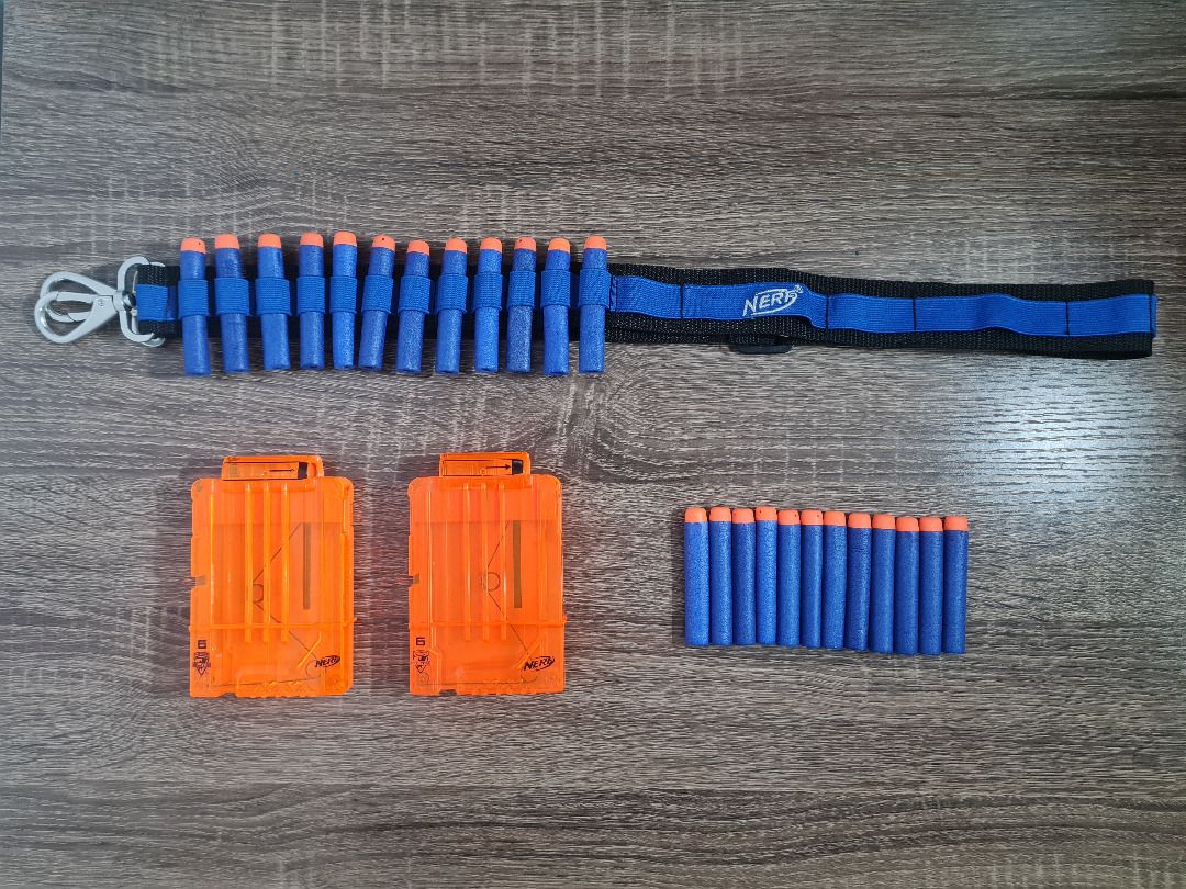 Nerf Bandolier Kit (Category: Action & Battle Toys) located in Pasig City. Submitted by jfvel (Listing ID 1316166981, Image 1). Description: Nerf N-Strike Elite Bandolier Kit/Ammo Strap Kit Includes: - Bandolier strap - 2 six-dart clips - 24 Elite darts Bandolier strap can hold up to 12 darts and 4 clips Clips are compatible with almost all Nerf blasters Elite darts are compatible with any Nerf Elite blaster and most original Nerf N-Strike blaste