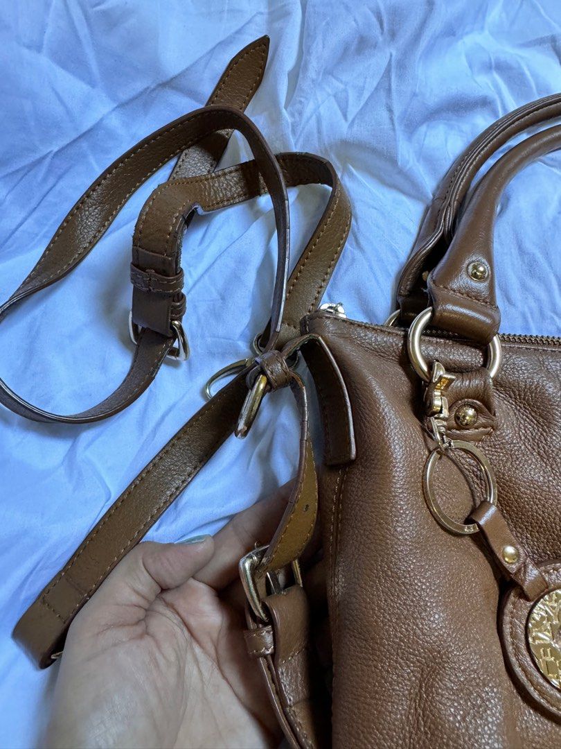 Sisley Genuine Leather Brown Two Way Bag (Category: Cross-body Bags) located in Davao. Submitted by stellietas (Listing ID 1316248162, Image 2). Description: Selling it low due to flaws. With small cracks and flaws on the linning or edges of the leather. But still good to use. Please see posted photos for details. Clean interior. With detachable sling strap..