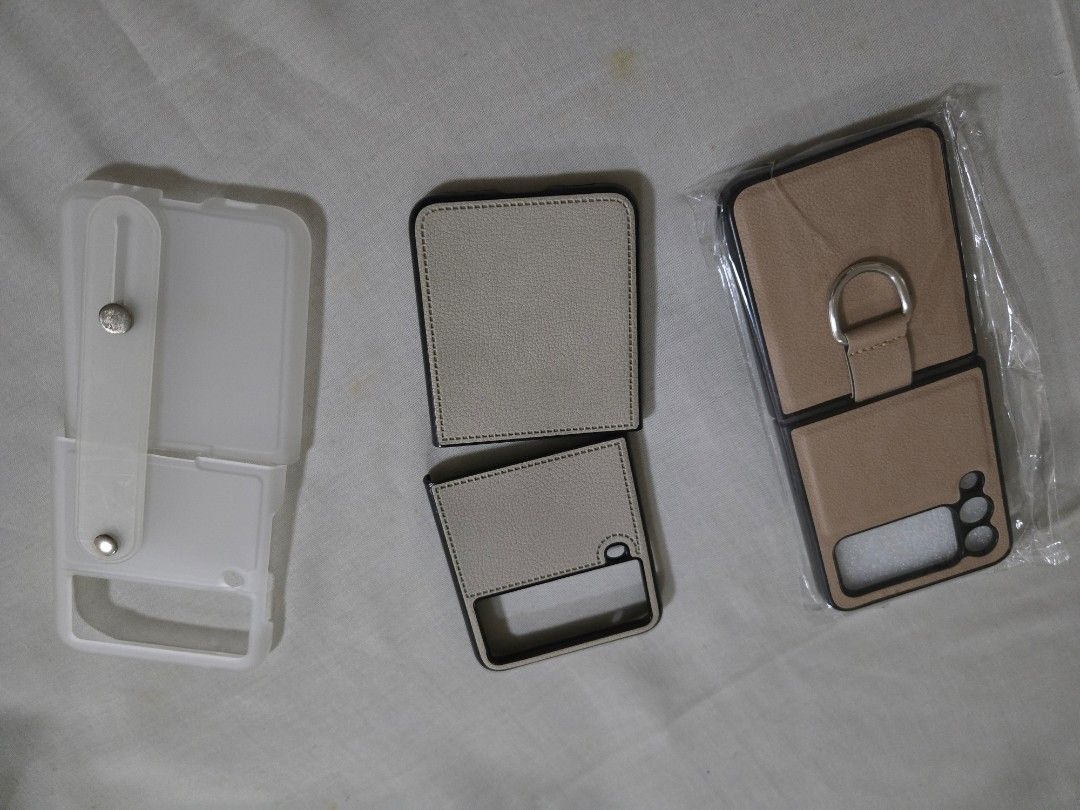 TAKE ALL 3: Galaxy Flip3 generic cases (Category: Cases & Sleeves) located in Mandaluyong City. Submitted by teambc (Listing ID 1316159485, Image 2). Description: Galaxy Flip3 phone cases take all 3 for P250 - beige leather case with ring - nude leather case - matte clear strap case.