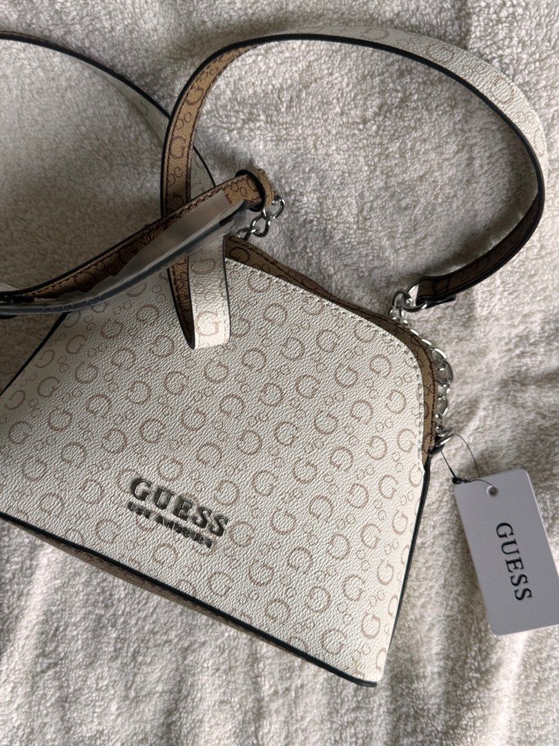 BRAND NEW AUTHENTIC GUESS SMALL SLING BAG FROM US (Category: Luxury Bags & Wallets) located in Manila. Submitted by closetdumpmnl (Listing ID 1316271272, Image 1). Description: BRAND NEW FROM US. NEVER USED. Super nice in actual. RFS: Decluttering.