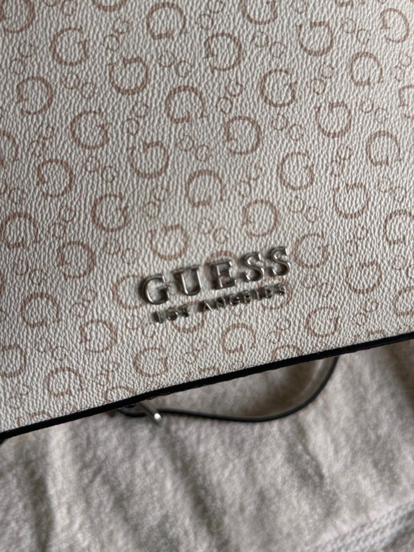 BRAND NEW AUTHENTIC GUESS SMALL SLING BAG FROM US (Category: Luxury Bags & Wallets) located in Manila. Submitted by closetdumpmnl (Listing ID 1316271272, Image 2). Description: BRAND NEW FROM US. NEVER USED. Super nice in actual. RFS: Decluttering.