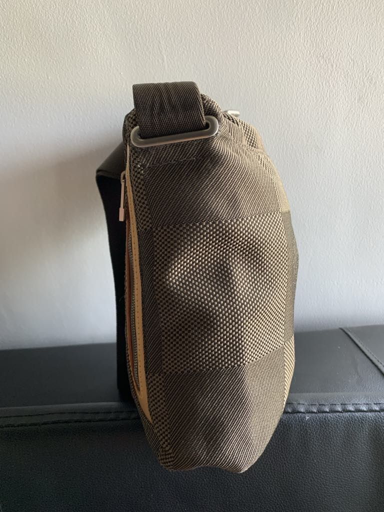 Authentic LV damier geante messenger bag (Category: Luxury Bags & Wallets) located in Las Pinas. Submitted by missyyyxx (Listing ID 1316302891, Image 3). Description: authentic 💯 rare and vintage! condition: 8/10 PM size (see last pic for size ref) slightly nego for sure buyer no inclusions, bag only Japan preloved current srp on other shops: 30k+ php bag is for men but can be unisex.