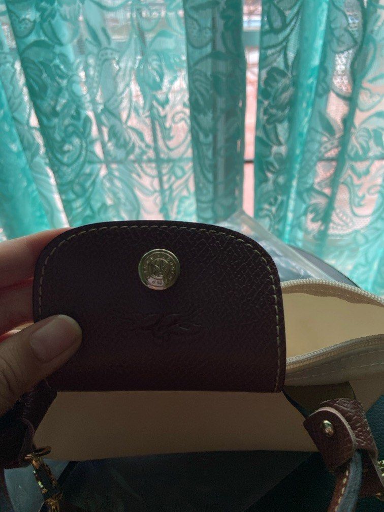 longchamp small pouch with free detachable sling! (Category: Purses & Pouches) located in Makati City. Submitted by bananayaa (Listing ID 1316270755, Image 3). Description: - good quality -with free detachable strap - with packaging - class a.