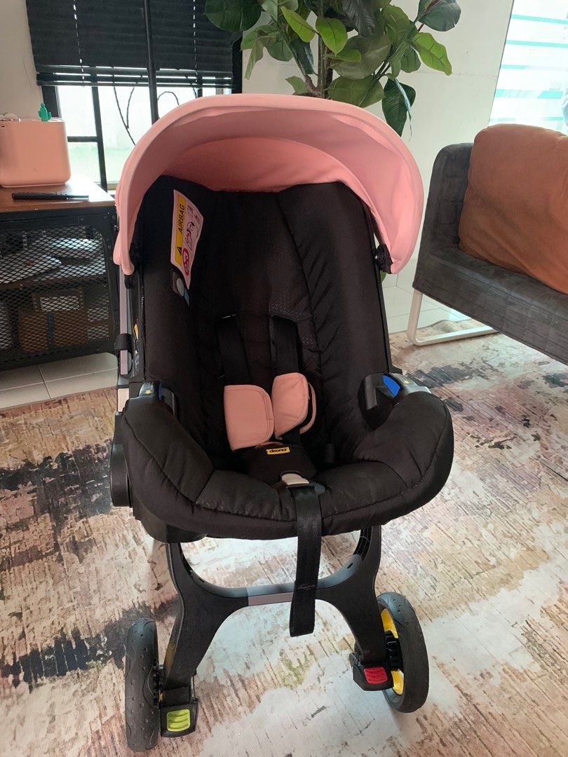 Doona (Category: Strollers) located in Johor Bahru. Submitted by cleverdolphin.d3aaf3 (Listing ID 1316406682, Image 3). Description: ORIGINAL DOONA PINK COLOUR .
