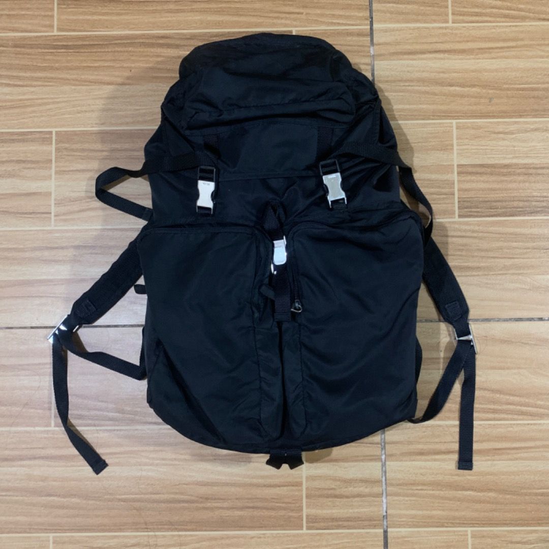 Prada Tessuto nylon backpack travel bag (Category: Luxury Bags & Wallets) located in Bacolod City. Submitted by boujee.wardrobes (Listing ID 1316346731, Image 3). Description: Prada Tessuto Nylon Backpack Travel Bag 30Liters Size XL Two Front Pockets One Top Pocket and Big storage inside Minor scratch on front pockets no issue rather than that Can give more detailed pictures on DM.