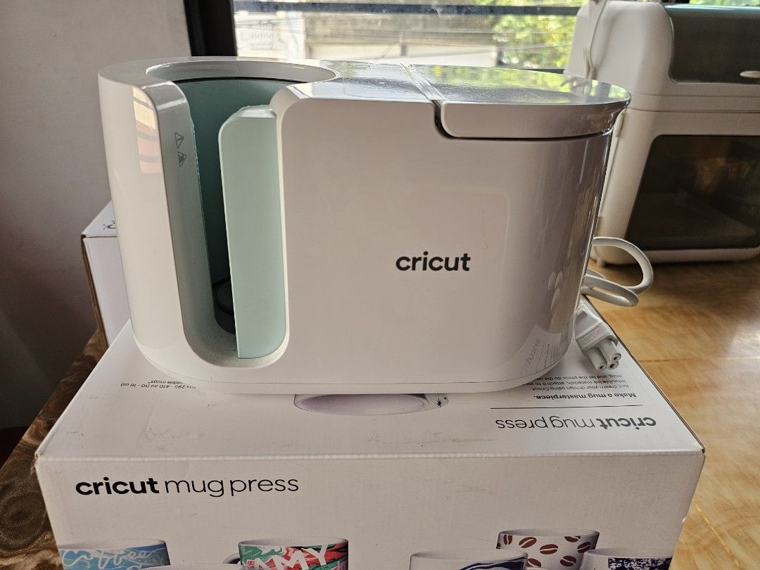 CRICUT MUG PRESS AND CRICUT EASY PRESS 2 (Category: Craft Supplies & Tools) located in Paranaque City. Submitted by well.loved_pre.loved (Listing ID 1316464653, Image 1). Description: FS : Cricut Easy Press 2 9" x 9" Portable Heat Press - bought at Happy Station January 2023 RFS : nakatambak lang po, minsan lang nagamit for personal use 😊 Like new condition. SELLING Price : 8k INCLUSIONS: - comes with box - free htv Also selling my CRICUT MUG PR