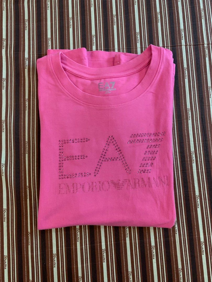 Emporio Armani Pink T-Shirt Authentic (Category: Shirts) located in Meycauayan. Submitted by try.declutters (Listing ID 1316524021, Image 1). Description: Authentic Emporio Armani Pink Full length Logo T-Shirt Bought this in Europe! Size: M (fits S-M) Condition: 9/10! see pictures Rfs: I don’t wear bright colors anymore.