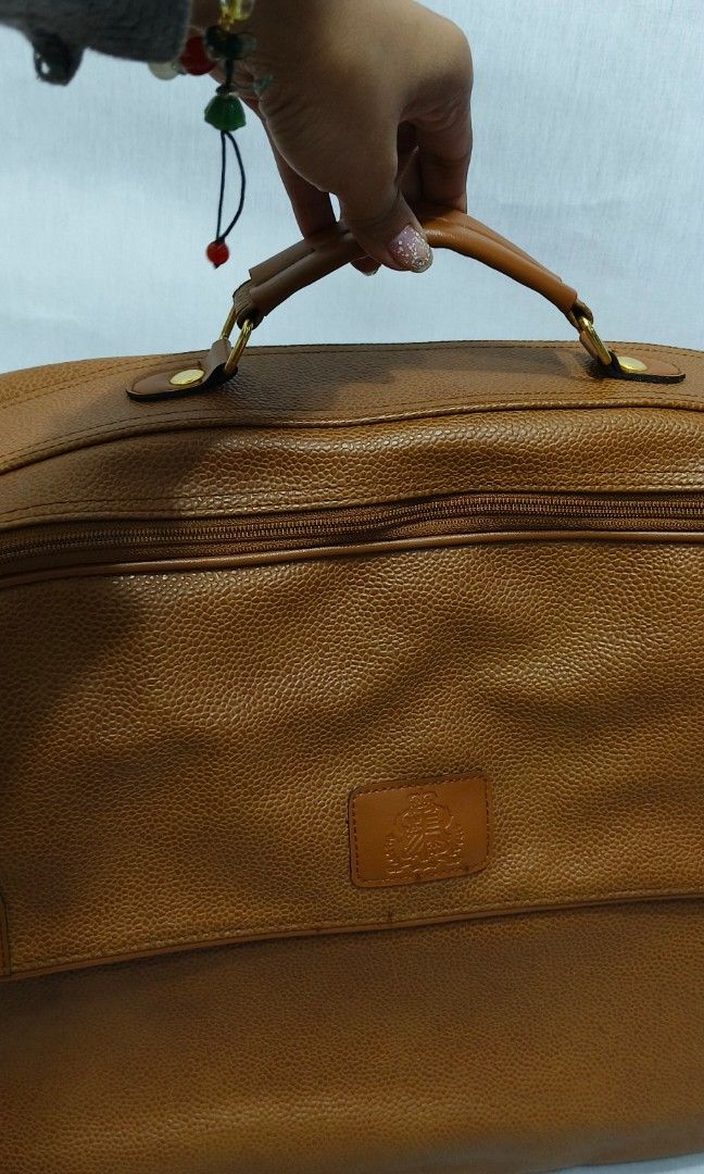 Leather Hand Carry Travel Bag (Category: Luxury Bags & Wallets) located in Baguio. Submitted by PreiLoveMaria (Listing ID 1316494434, Image 2). Description: Leather Hand Carry Travel Bag Very good used condition H: 13c L: 18" D: 7" Very Spacious Kindly check the Detailed photos Shipping via J&T only No COD and COP Item is from Japan Surplus.