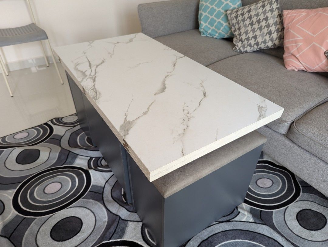 Multi function Coffee Table (Category: Tables & Sets) located in Singapore. Submitted by amiyap (Listing ID 1316470278, Image 2). Description: Lightly Used Multifunction Coffee Table. Opens up to a big size of 110cmx105cm. Folds down to coffee table size. Storage unit is NOT included German Hydrolic Technology for smooth closing action. New one costs around $1000 Just one year old. will include two wheel sets for free. Selling as moving out..