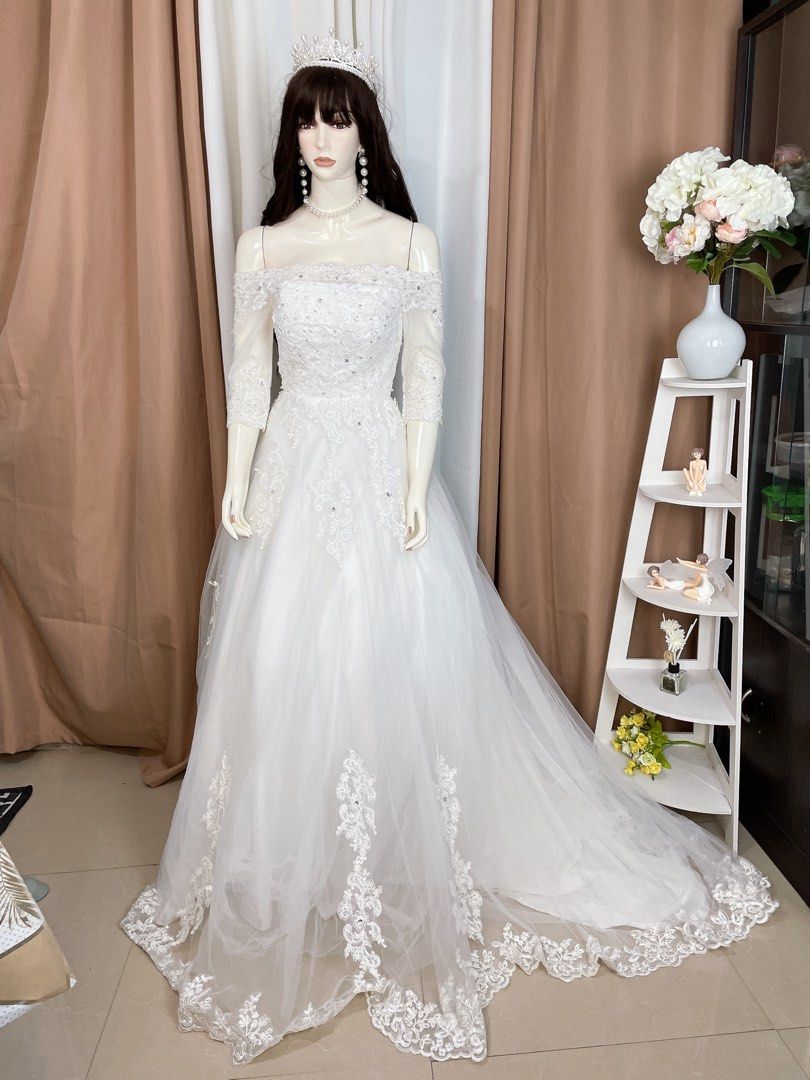 Off shoulder long trail wedding gown (Category: Evening dresses & gowns) located in Dasmarinas. Submitted by legitbeauty08 (Listing ID 1316451595, Image 3). Description: Long trail Small to medium Waist up to 32 Adjustable lace.