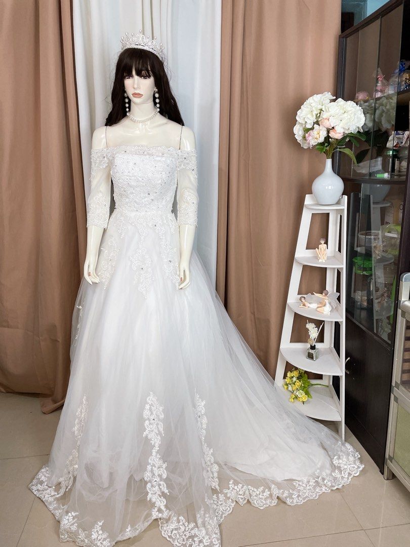 Off shoulder long trail wedding gown (Category: Evening dresses & gowns) located in Dasmarinas. Submitted by legitbeauty08 (Listing ID 1316451595, Image 1). Description: Long trail Small to medium Waist up to 32 Adjustable lace.