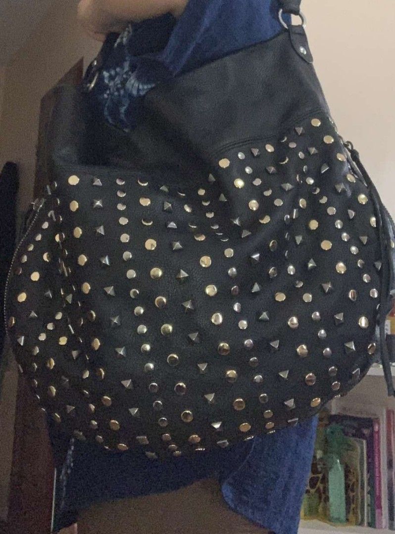 Rebecca Minkoff hobo studded bag (Category: Shoulder Bags) located in Cabuyao City. Submitted by _disposedarmoire_ (Listing ID 1316618550, Image 2). Description: Read: -hobo bag by Rebecca Minkoff -leather is still like new -studs are in gun metal, gold and silver -lining is cotton and printed -heavy leather -perfect for your casual attire - linis lang ng lining ang nagpababa ng value - one of the best bag leathers in my experience #listsellwin F