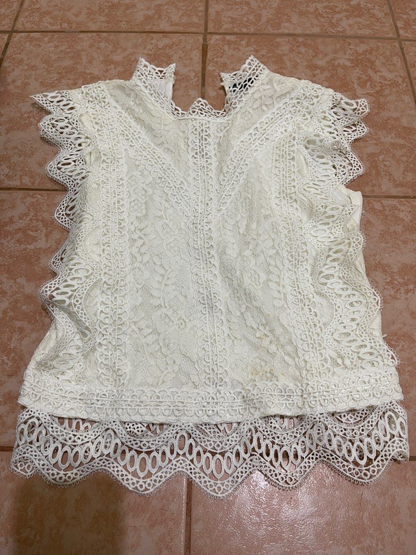 White lace top (Category: Blouses) located in San Fernando. Submitted by chatitay (Listing ID 1316603330, Image 1). Description: Used only once sa wedding Has minimal discoloration ‘coz of storage, not super obvious (see pic) fits xs to s Shipping will be shouldered by the buyer MOP gcash.