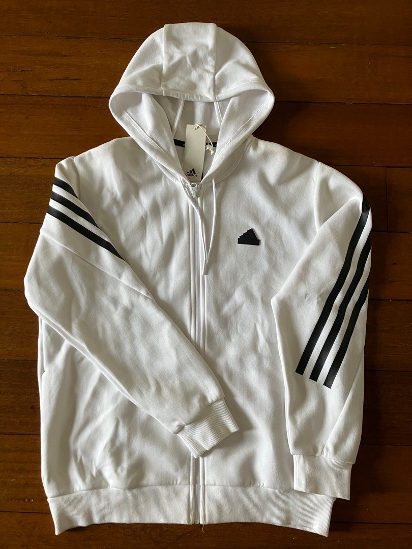 Adidas Hoodie Track Top (Category: Coats, Jackets and Outerwear) located in Makati City. Submitted by go2gal (Listing ID 1316670968, Image 2). Description: Adidas Hooded Sweater Jacket Track Top New/Unused White Full zip, with side pockets Signature 3 stripes detail on sleeves, and chest logo Size Men’s A/L (23” chest width, 19.5” shoulder when laid flat) Bought in-store Price: P2,990 RFS: wrong size/received as gift MOP: Gcash or BPI Shipping: c