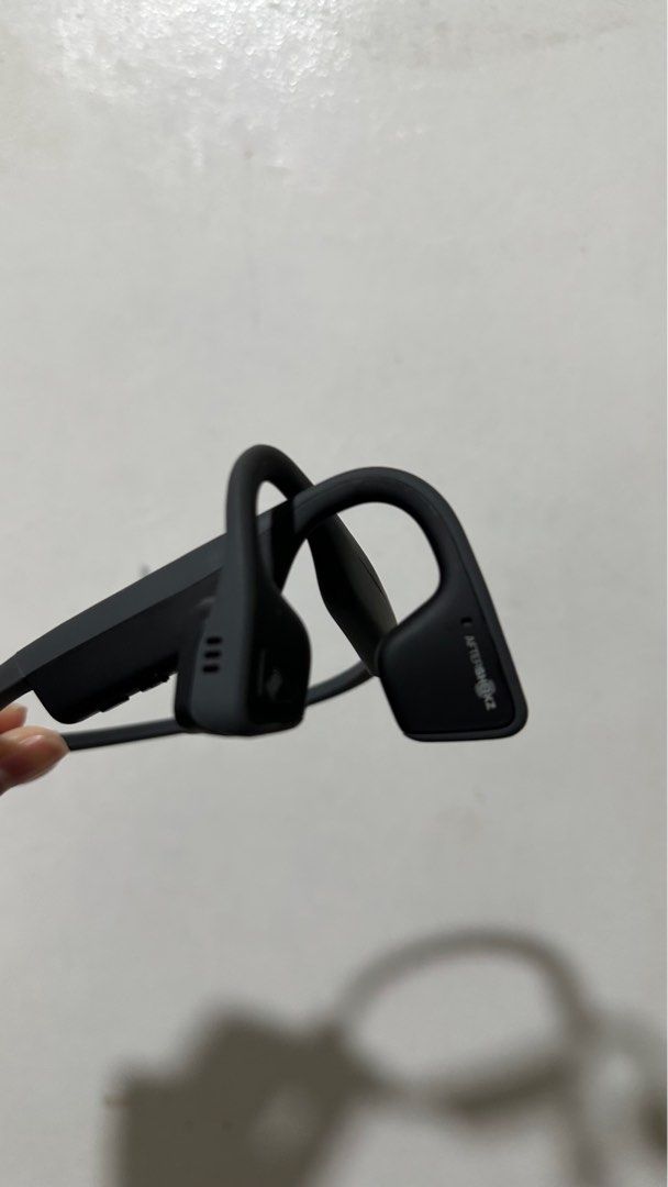 AfterShokz Titanium Bone Conduction Headset (Category: Headphones & Headsets) located in Las Pinas. Submitted by calizoosh (Listing ID 1316731127, Image 2). Description: AfterShokz Titanium Headset: - Bone Conduction - Comes with original carrying pouch - the only issue is that there is no charging port cover - Charges with micro-usb - For the pouch: the issue is that some of the leather is peeling off but its only small chunks, also comes with a