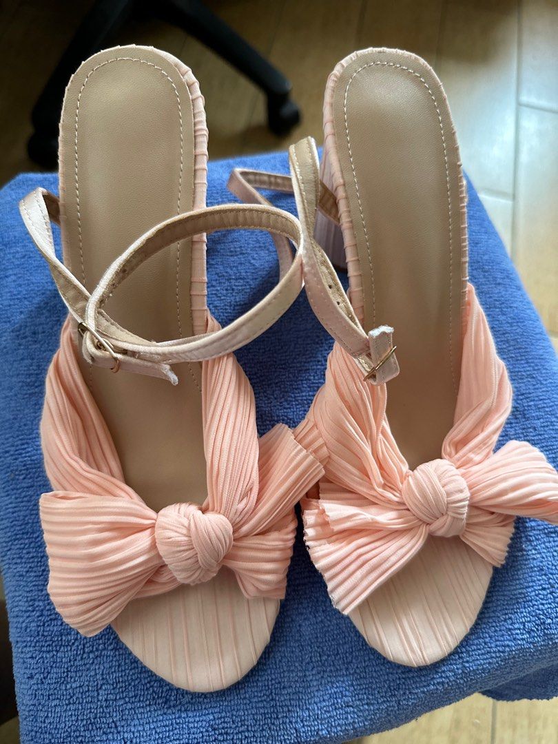 Elegant Bowknot block high heels pink size 8 (Category: Heels) located in Quezon City. Submitted by nixieeee (Listing ID 1316670882, Image 2). Description: Used for reception Bought online for almost 2 k Very comfortable, lace ribbon Around 1.5 heels Location: near San Mateo Rizal.