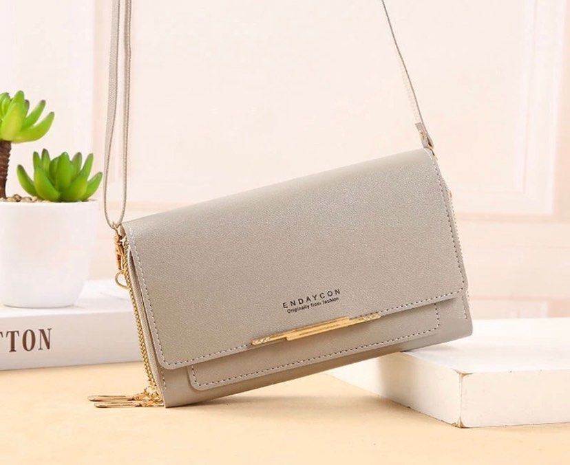 Grey Sling Bag (Category: Shoulder Bags) located in Singapore. Submitted by goodshitonly (Listing ID 1316634416, Image 1). Description: Check my page out for more bag designs !! Self collect at Clementi mrt station Accept cash and paynow If interested pls pm me .