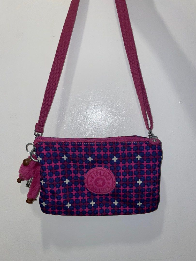 SALE!!! Kipling Cross-body Bag (Category: Cross-body Bags) located in Manila. Submitted by miniscloset (Listing ID 1316762577, Image 1). Description: - Color: Pink and Purple - Original, from Las Vegas USA - Good as new - Shipping fee c/o of buyer PM for more photos and information..