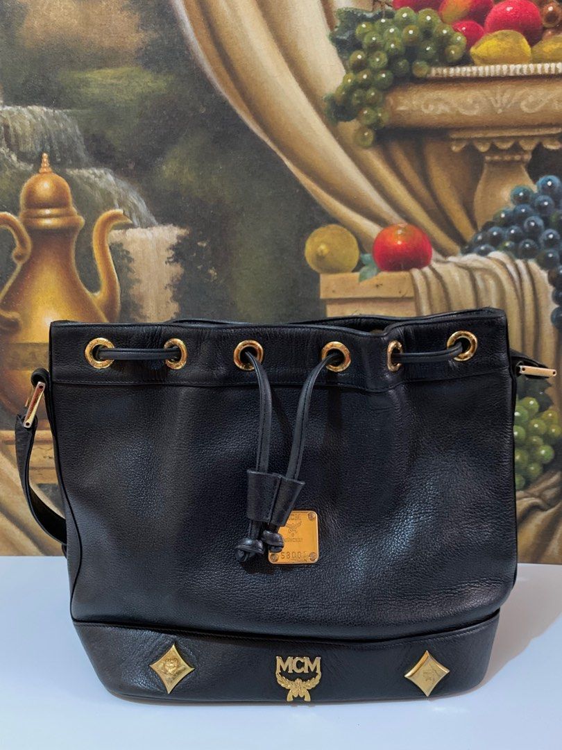 MCM bucket bag (Category: Luxury Bags & Wallets) located in Muntinlupa City. Submitted by phbudgetluxuryfinds (Listing ID 1316668084, Image 2). Description: Authentic 💯 Genuine Leather 💯 Clean interior Turnable screw on emblem plate Adjustable strap Black color .
