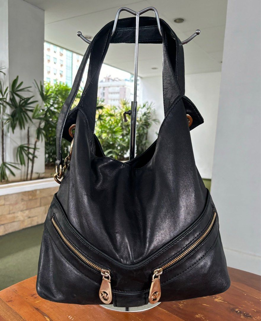 Michael Kors Jamesport two-way bag (Category: Luxury Bags & Wallets) located in Pasig City. Submitted by lexans_bentables (Listing ID 1316700898, Image 1). Description: Authentic Michael Kors Jamesport two-way bag ❣️ CLEARANCE SALE ❣️ - very soft leather that slouches when empty - can be worn as shoulder bag or crossbody bag - can fit at least 13-inch laptop - clean interior lining, no foul smell - shiny gold hardware - intact corners and edges N