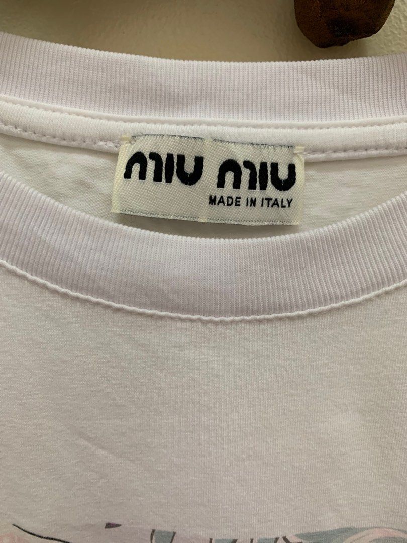 Miu Miu x Sailor Moon shirt (Category: Luxury Apparel) located in Calamba. Submitted by mineyourscollection (Listing ID 1316808574, Image 3). Description: Preloved In good condition Issue: minimal stains, barely noticeable Size: width: 20 inches; length: 23.5 inches Best fit medium for women .