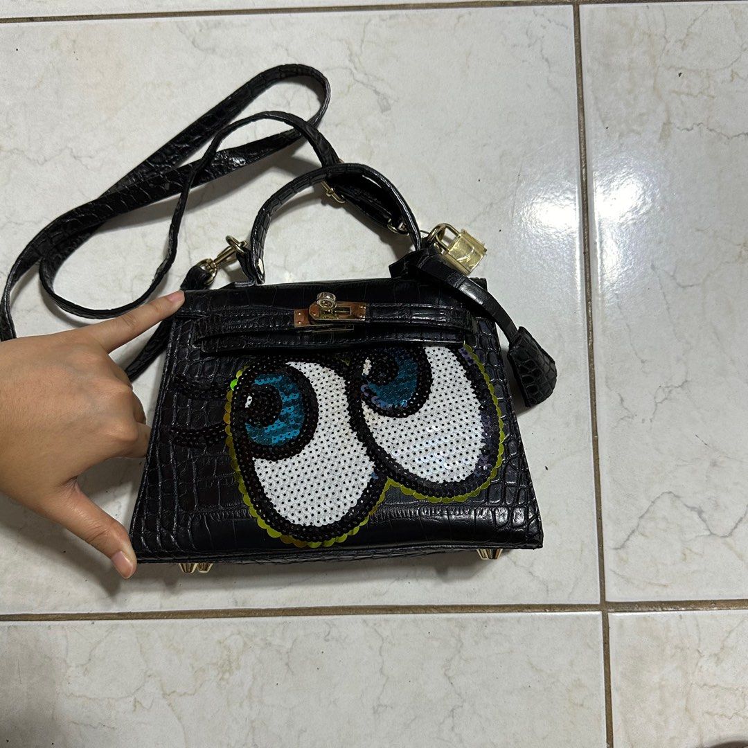 Play No More Black Sling Bag (Category: Luxury Bags & Wallets) located in Pasig City. Submitted by decluttertrends (Listing ID 1316643275, Image 3). Description: -good as new -flaws/ signs of usage on pic #5-8 -inside of bag very clean -hardware under is clean -korean bag brand -condition 8/10.