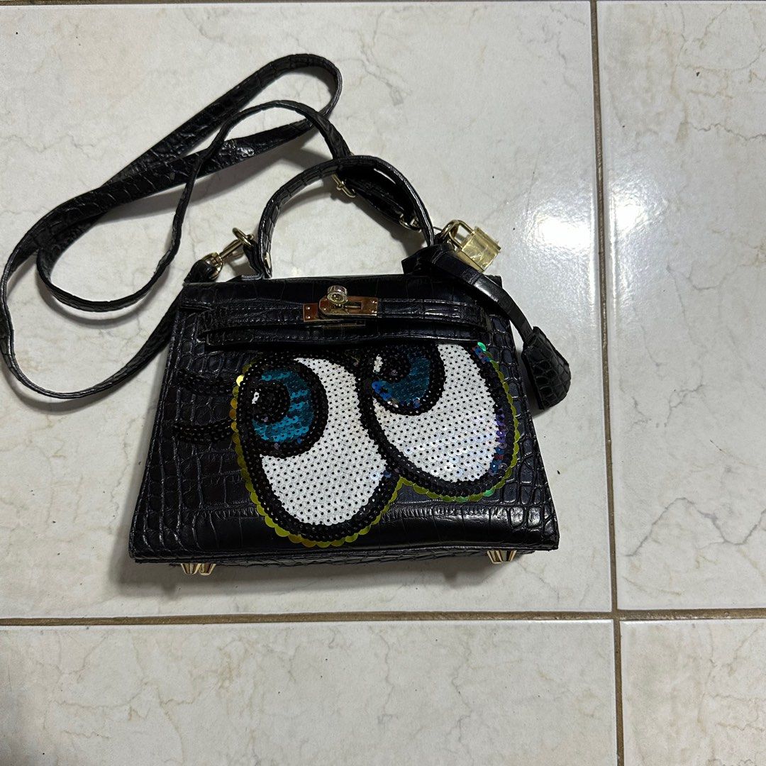 Play No More Black Sling Bag (Category: Luxury Bags & Wallets) located in Pasig City. Submitted by decluttertrends (Listing ID 1316643275, Image 1). Description: -good as new -flaws/ signs of usage on pic #5-8 -inside of bag very clean -hardware under is clean -korean bag brand -condition 8/10.