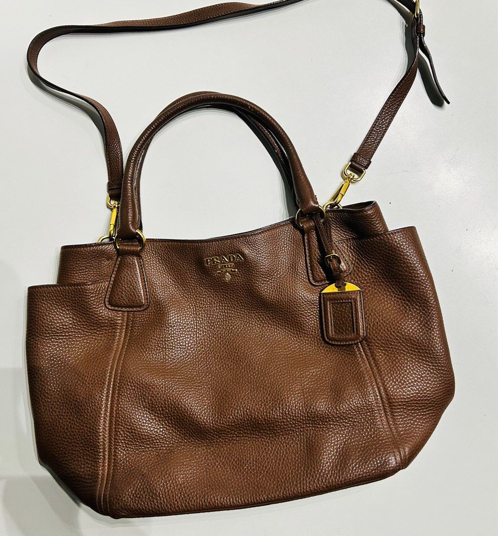 Prada Brown Handbag Authentic (Category: Luxury Bags & Wallets) located in Paranaque City. Submitted by caityprecky (Listing ID 1316790167, Image 1). Description: Prada brown leather Vitello Daino bag. Bought in Italy. Authentic. Medium size.