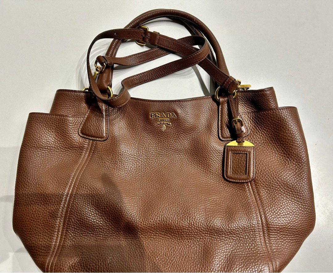 Prada Brown Handbag Authentic (Category: Luxury Bags & Wallets) located in Paranaque City. Submitted by caityprecky (Listing ID 1316790167, Image 3). Description: Prada brown leather Vitello Daino bag. Bought in Italy. Authentic. Medium size.