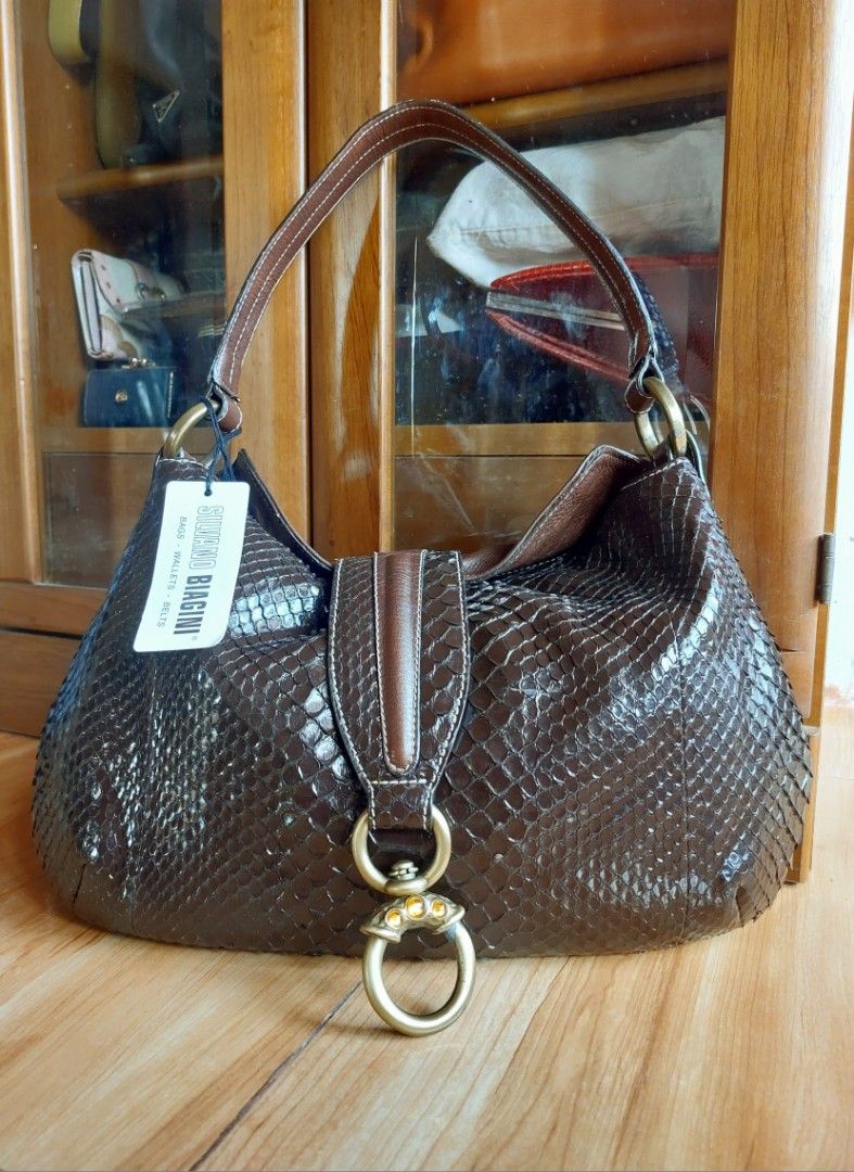 Silvano Biagini bag (Authentic Luxury) (Category: Luxury Bags & Wallets) located in Davao. Submitted by wengbagstuff (Listing ID 1316706627, Image 1). Description: 🍀 python material & genuine leather 🍀 Italian designer bag (pricey on market) 🍀 flawless body but w/ tarnish on hardwares 🍀 w/ 3 stones (i think it's citrine).