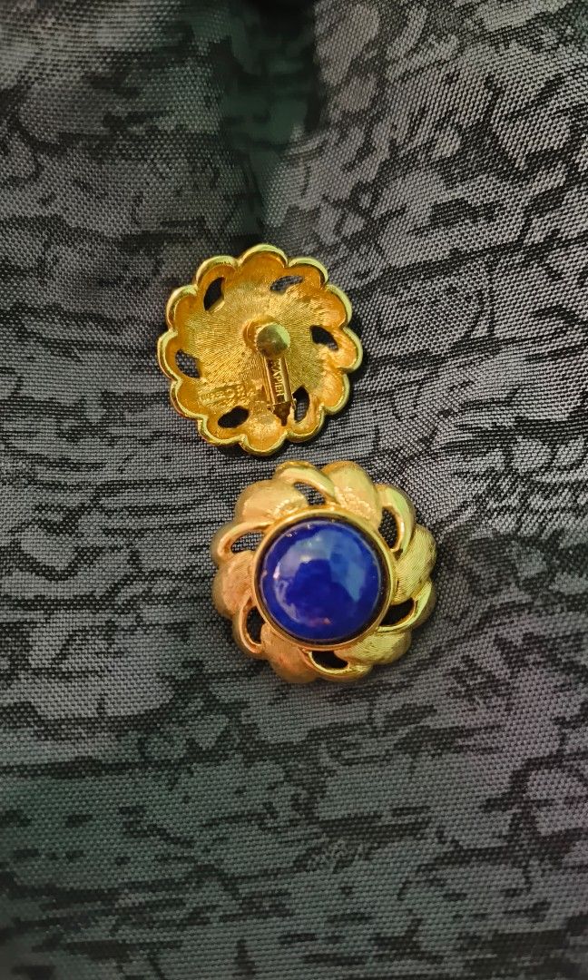 Vintage Napier Blue Earrings (Category: Earrings) located in Rizal. Submitted by yves1211 (Listing ID 1316707309, Image 3). Description: Rare! 1960s goldtone cabochon faux-lapis with gold flecks with clip and screw backs. Marked "NAPIER" on the clips and "NAPIER©" on the backs with L and R so you can tell which earring is which. Measure: 1 3/16 inches across. Condition: Very good; minor wear to the back of one earring where the clips meet the bac