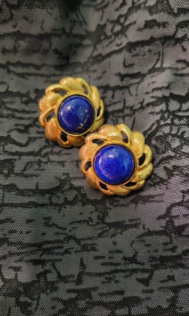 Vintage Napier Blue Earrings (Category: Earrings) located in Rizal. Submitted by yves1211 (Listing ID 1316707309, Image 2). Description: Rare! 1960s goldtone cabochon faux-lapis with gold flecks with clip and screw backs. Marked "NAPIER" on the clips and "NAPIER©" on the backs with L and R so you can tell which earring is which. Measure: 1 3/16 inches across. Condition: Very good; minor wear to the back of one earring where the clips meet the bac