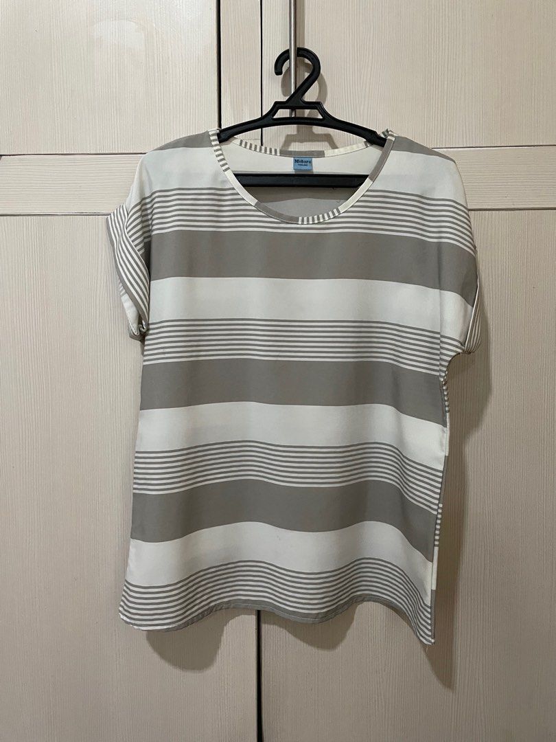 White Grey Stripes Top (Category: Blouses) located in Manila. Submitted by adrchn (Listing ID 1316713485, Image 1). Description: - received as Thailand souvenir - Moboro Brand (with tag) - no size indicated - can fit S-M frames - short sleeves - fabric does not stretch ☆ measurements ☆ Bust: 36" Length: 22".