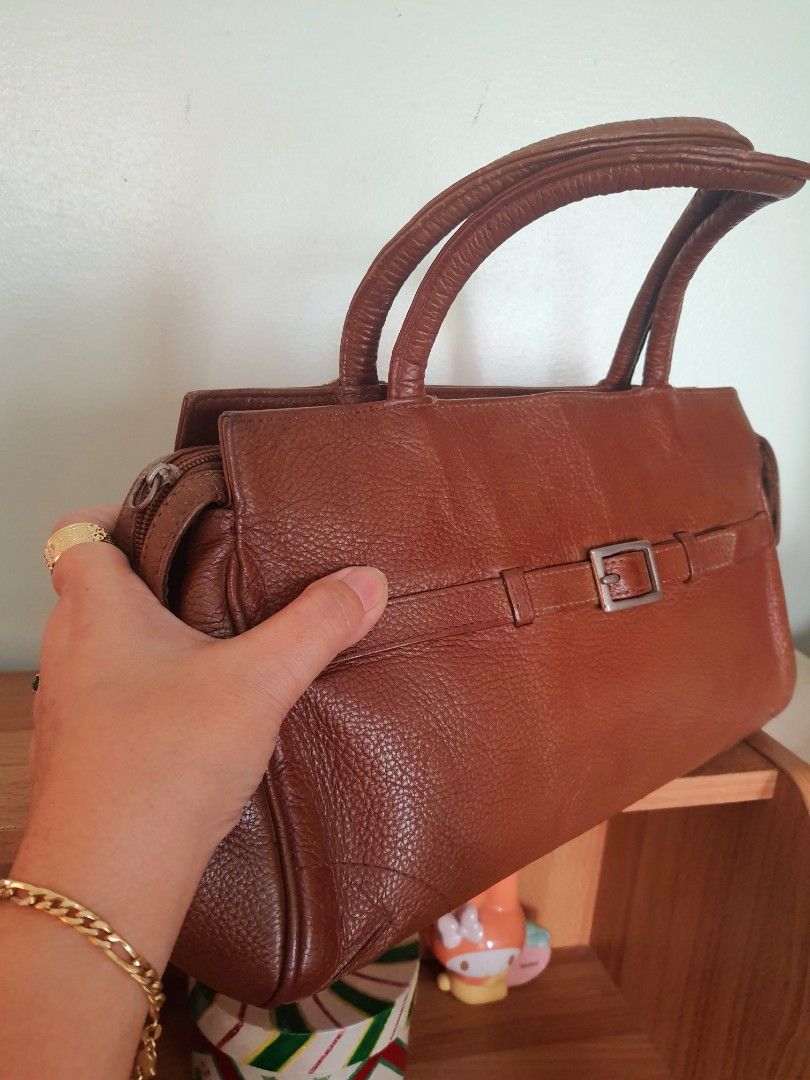 Wilsons Leather Top Handle Satchel Bag (Category: Shoulder Bags) located in Quezon City. Submitted by pinksgate31 (Listing ID 1316642466, Image 3). Description: British Tan Pebble Leather Satchel Bag. Personal preloved.With minimal issue. Free shipping..