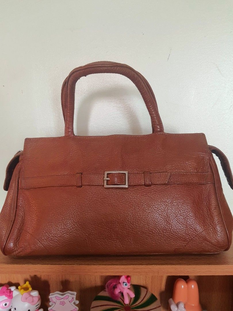 Wilsons Leather Top Handle Satchel Bag (Category: Shoulder Bags) located in Quezon City. Submitted by pinksgate31 (Listing ID 1316642466, Image 1). Description: British Tan Pebble Leather Satchel Bag. Personal preloved.With minimal issue. Free shipping..