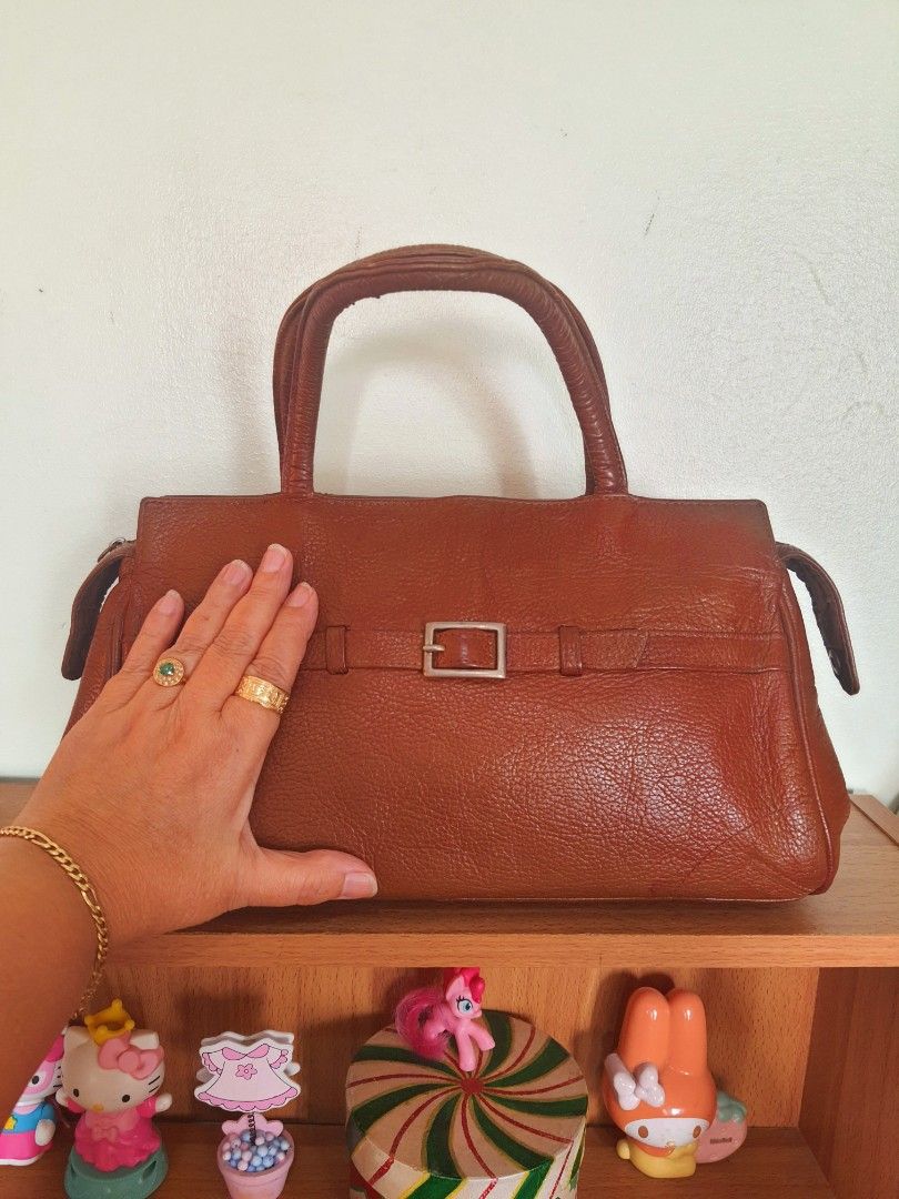 Wilsons Leather Top Handle Satchel Bag (Category: Shoulder Bags) located in Quezon City. Submitted by pinksgate31 (Listing ID 1316642466, Image 2). Description: British Tan Pebble Leather Satchel Bag. Personal preloved.With minimal issue. Free shipping..