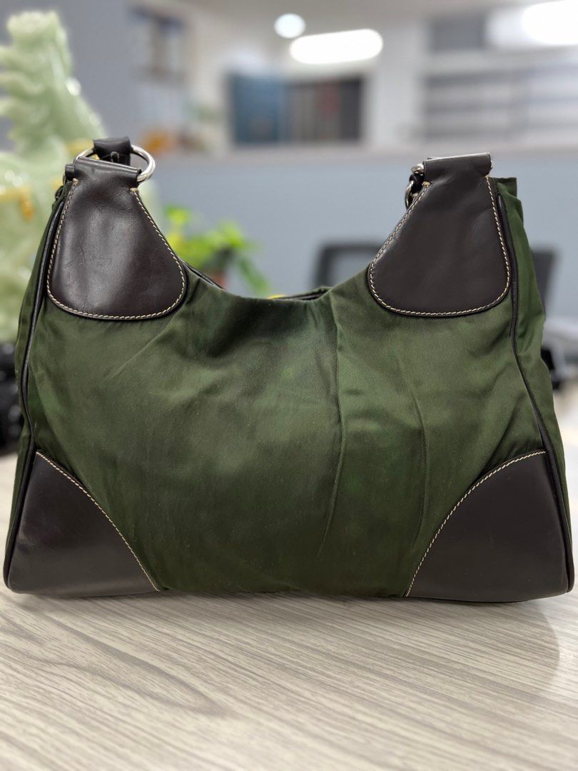 Authentic Prada Nylon Bag (Category: Luxury Bags & Wallets) located in Cagayan de Oro. Submitted by riggstuffs (Listing ID 1316986048, Image 2). Description: ➡️ guaranteed Authentic Prada Nylon bag in army green color Made in Italy With code Nylon material has no discoloration, leather is good. Interior area is clean No other inclusion Disclaimer : Riggstuffs is not associated or affiliated with the brand posted. All copyrights and trademarks bel