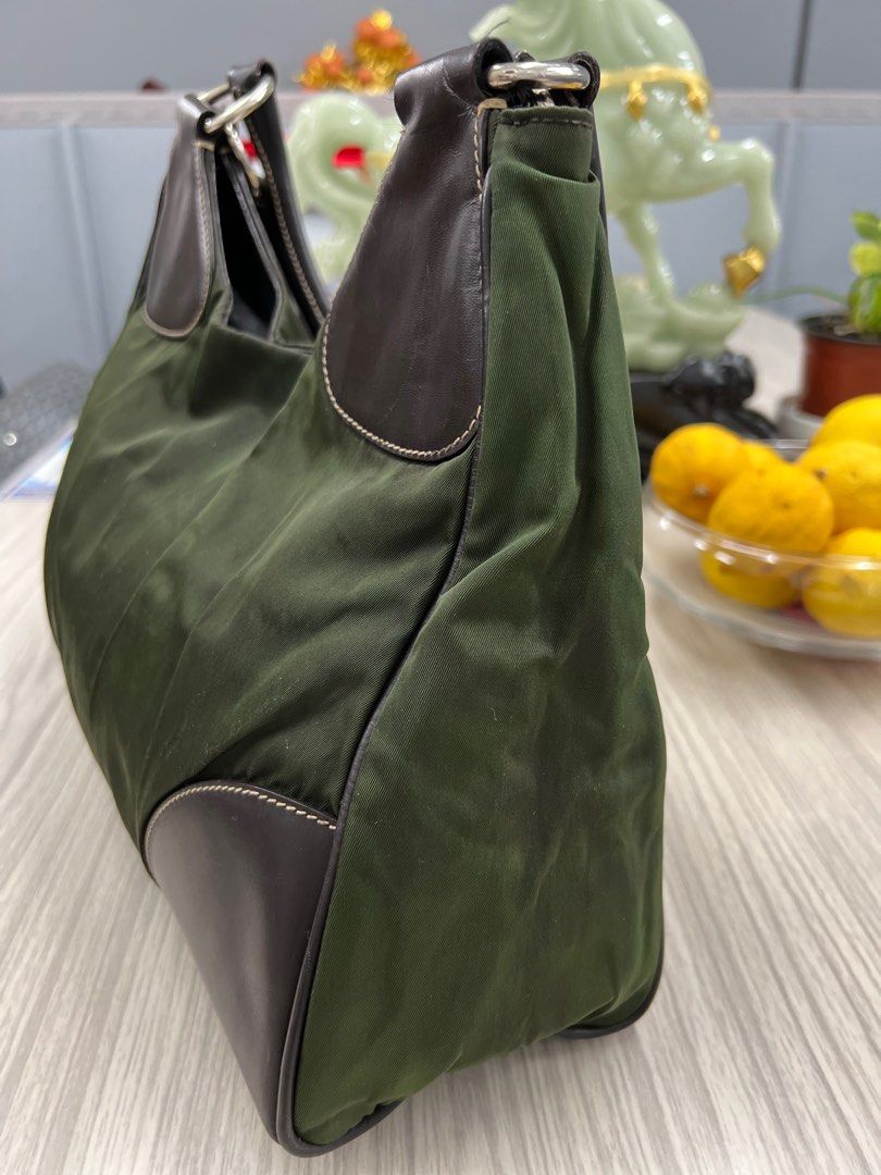 Authentic Prada Nylon Bag (Category: Luxury Bags & Wallets) located in Cagayan de Oro. Submitted by riggstuffs (Listing ID 1316986048, Image 3). Description: ➡️ guaranteed Authentic Prada Nylon bag in army green color Made in Italy With code Nylon material has no discoloration, leather is good. Interior area is clean No other inclusion Disclaimer : Riggstuffs is not associated or affiliated with the brand posted. All copyrights and trademarks bel