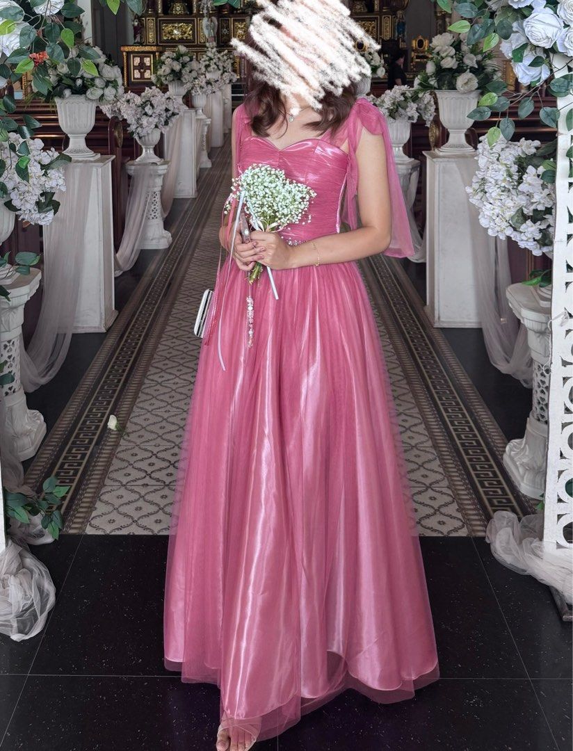 Pink bridesmaid gown with slit (Category: Evening dresses & gowns) located in Taguig. Submitted by dblnpat (Listing ID 1316847674, Image 3). Description: Bridesmaid gown in pink Size Ref: 5’4 height + 1.5 inch heels 30-32” bust 24” waist 54.5” length from shoulder to bottom With slit Once worn only Rfs: served its purpose.