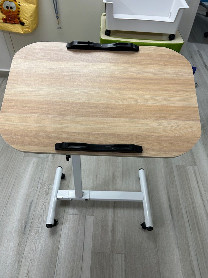 Adjustable table (Category: Tables & Sets) located in Singapore. Submitted by jasonchia762 (Listing ID 1317144689, Image 2). Description: Adjustable table. Lightly used. 1.5years old..