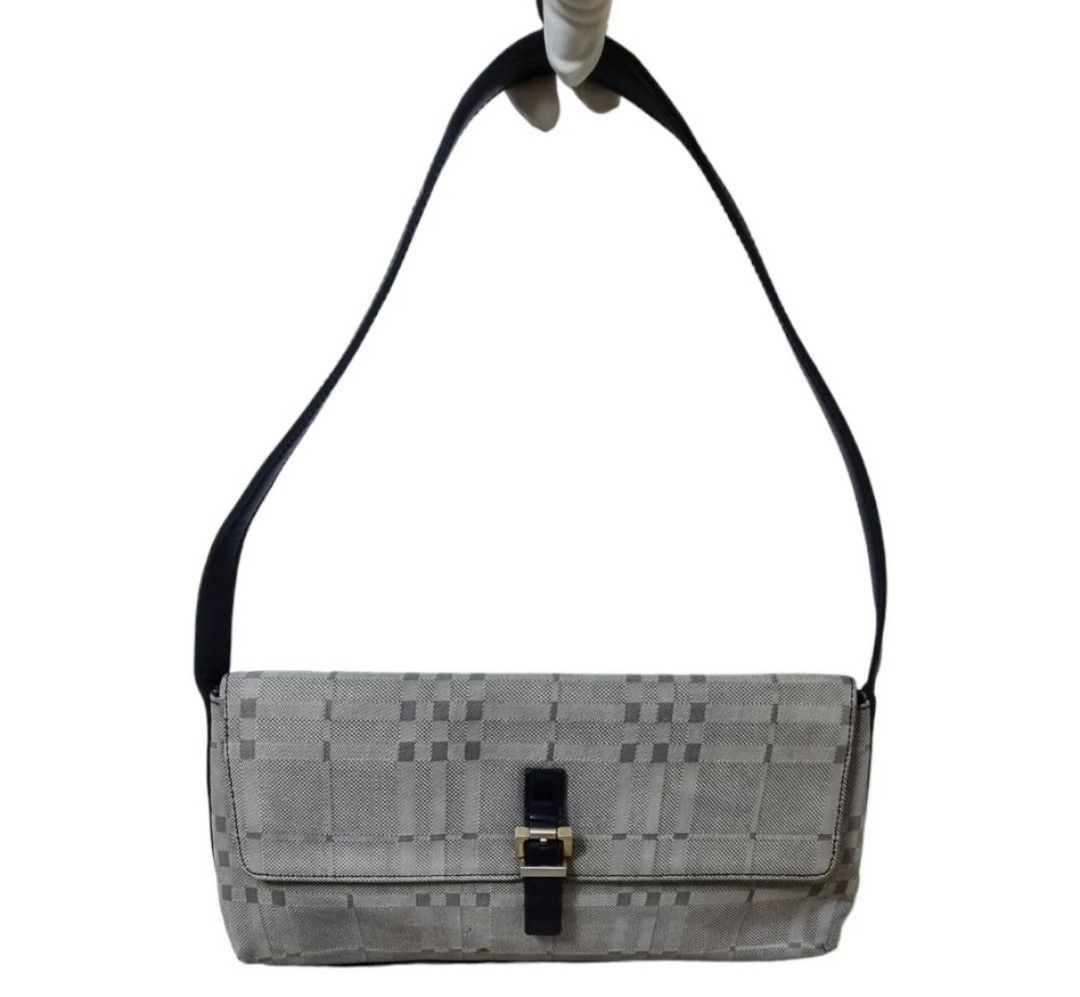 Authentic BURBERRY Bagguette bag (Category: Luxury Bags & Wallets) located in Quezon City. Submitted by maneradesignersboutique (Listing ID 1317011741, Image 1). Description: Money back Guarantee 💯% Guaranteed authentic *Brand: BURBERRY Bagguette bag *Materials: Canvas *Color: gray black *Size: small -Medium *Condition: 8/10 never been spa -Used * Inclusions: dustbag All items purchased from manera has less 30% Discount in restoration lifetime. 