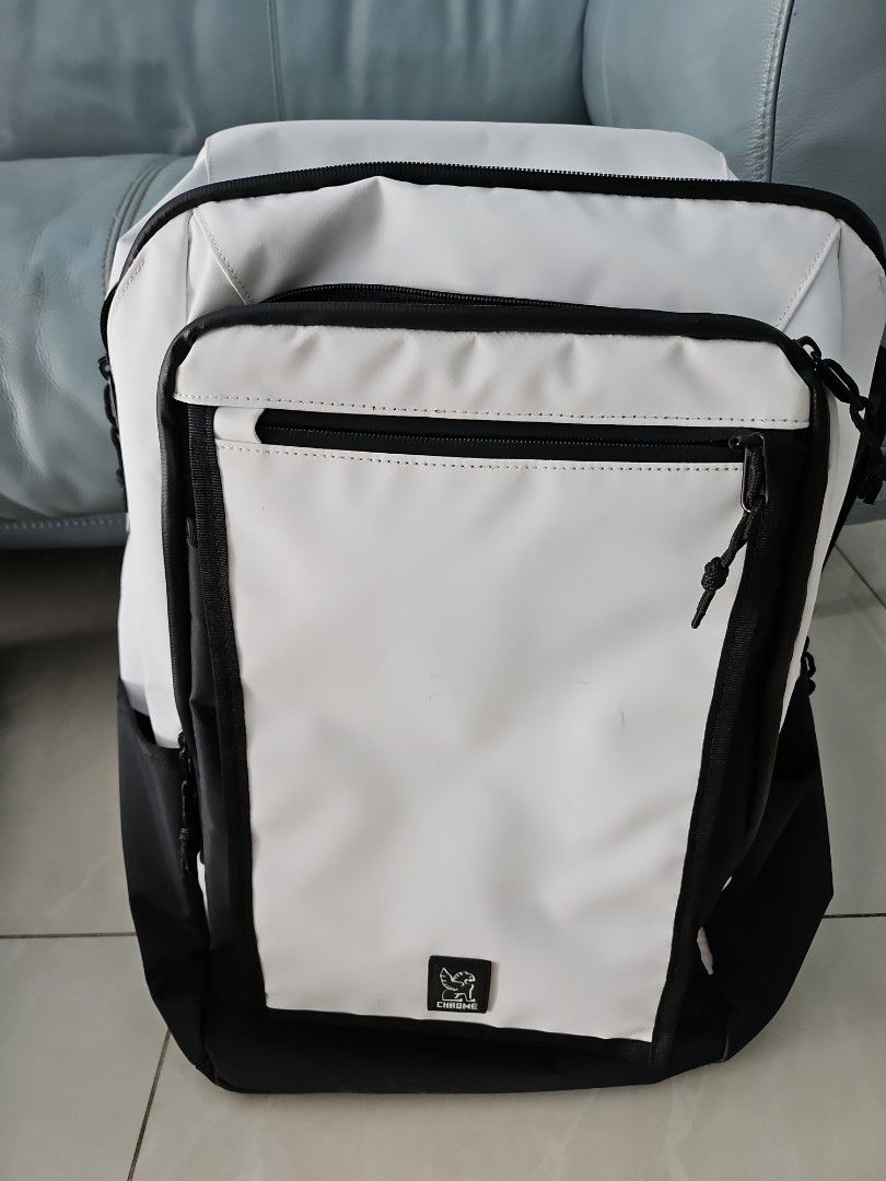 Chrome Backpack (Category: Backpacks) located in Singapore. Submitted by blueberryhome (Listing ID 1317025915, Image 1). Description: a few visible stains because it's white but have only used this twice so inner still in very good condition 50x18x15 cm.