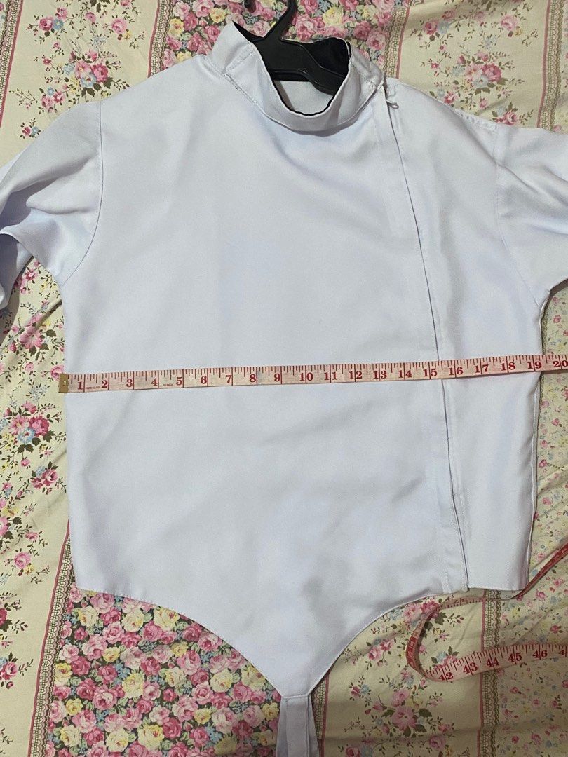 Fencing jacket - right handed (unbranded) (Category: Other Sports Equipment and Supplies) located in Paranaque City. Submitted by daechwi7a (Listing ID 1317111101, Image 2). Description: Used for only a semester of PE. There are 3 small, visible stains from playing but I think they can easily be scrubbed off! Measurements are shown in the pictures. It has an adjustable strap at the bottom so it can extend for another 21 inches. Please manage your