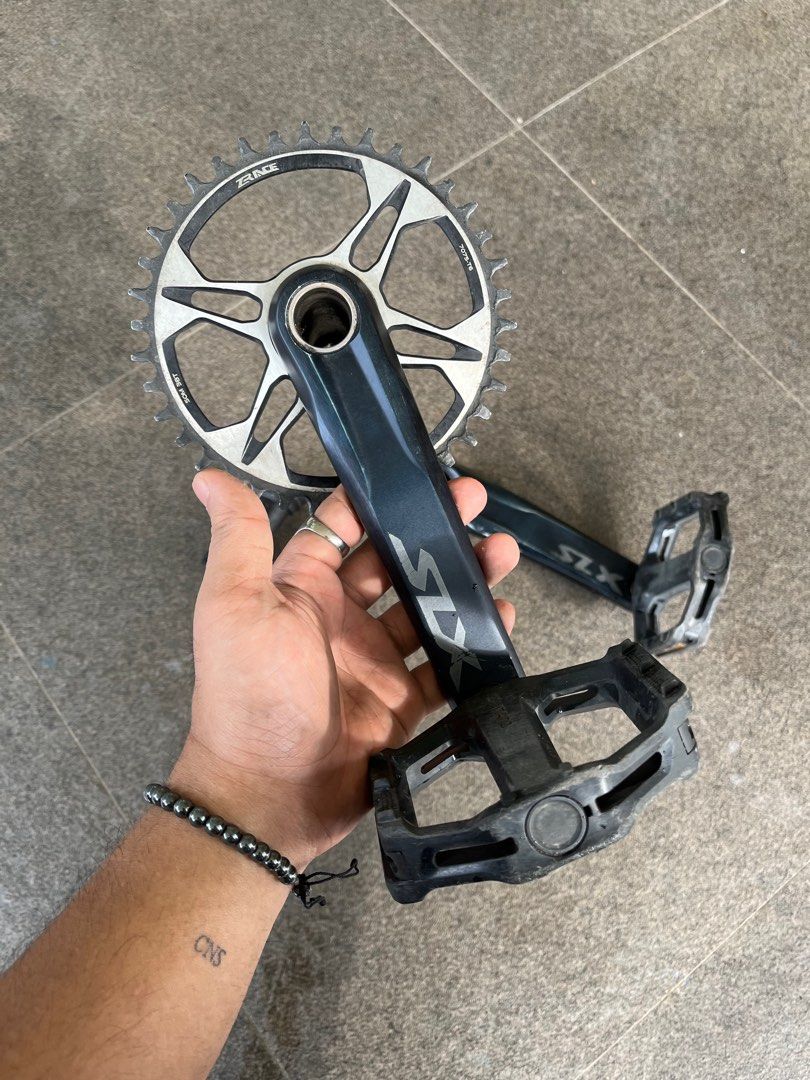 Shimano SLX Crankset (Category: Bicycles) located in Quezon City. Submitted by jawnzslayer (Listing ID 1317125942, Image 2). Description: shimano slx crankset shimano bottom bracket z race 38T chainring shimano flat pedals.